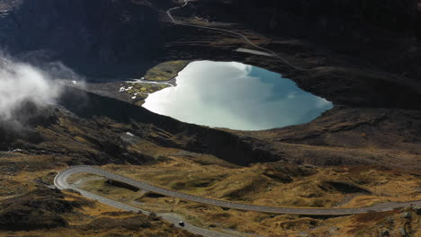 cinematic rotating drone shot of the steinsee lake along the susten pass, switzerland