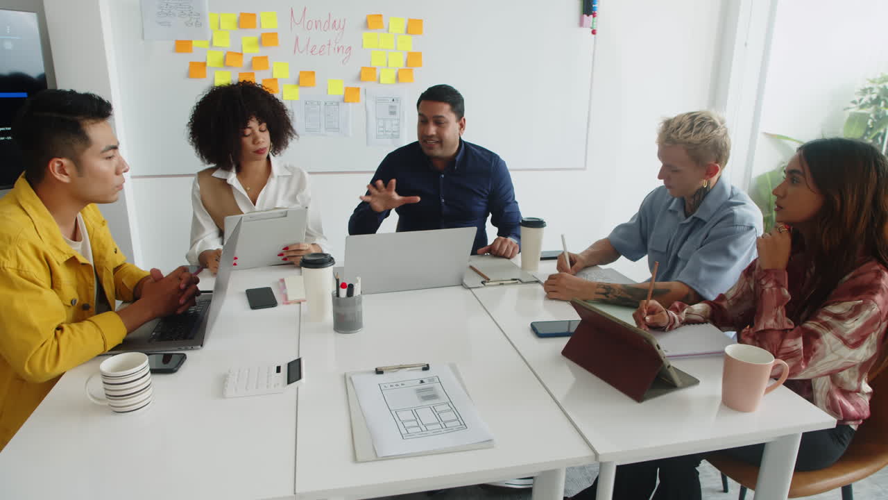 Diverse Team of IT Workers Having Meeting at Office