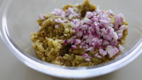 minced fried eggplant and chopped onions - close up