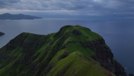 flying a lush mountainous ridge of padar island just after sunrise