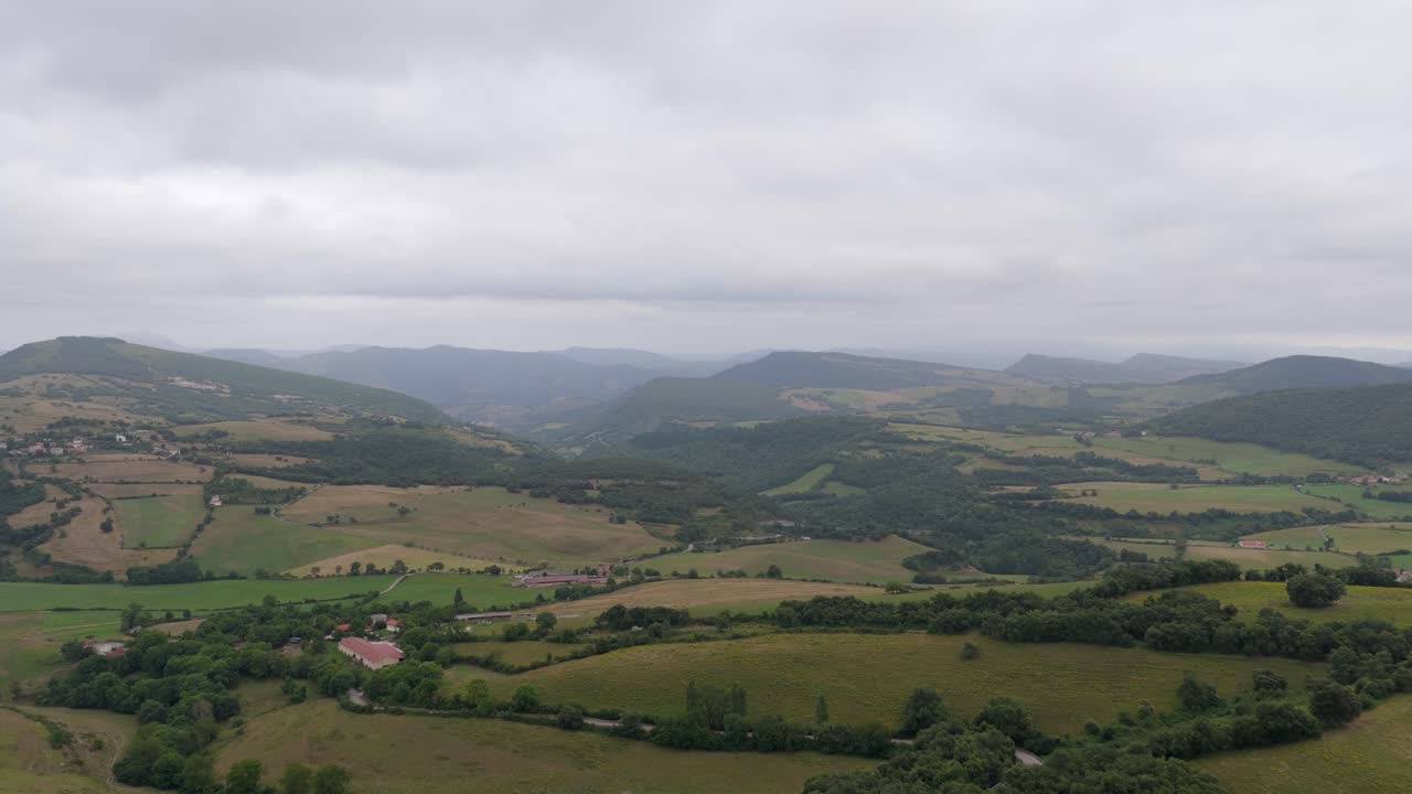 Overcast sky above a lush green rural valley