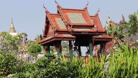 scenic view of a thai pavilion among tropical plants