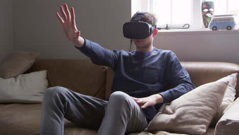 man at home wearing virtual reality headset shot on r3d