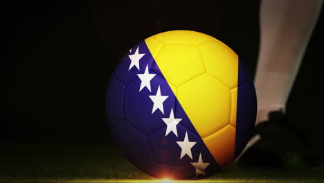 Football-player-kicking-bosnia-flag-ball