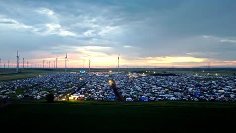 Austrian-Nova-Rock-Festival-In-Pannonia-Fields-II,-Nickelsdorf,-Austria---aerial-pullback