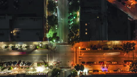 Aerial-hyperlapse-looking-down-on-Friday-night-traffic-in-downtown-Macon,-Georgia-on-Cherry-Street