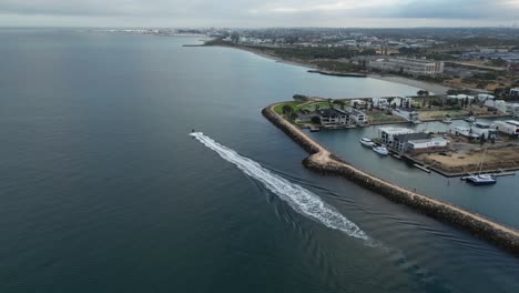Aerial-view-of-speedboat-cruising-on-coast-of-Perth-City-at-Coogee-Port