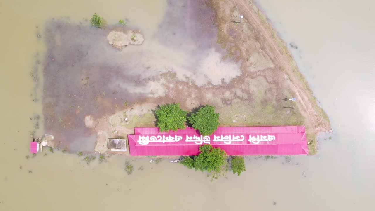 Top Down View Of School Surrounded With Flood Water In Bangladesh - Drone Shot