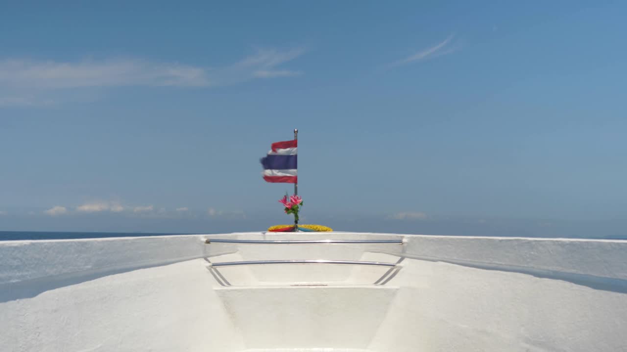 Thai Flag In The Bow Ferry Boat Across The Andaman Sea Water Over Thailand. POV Shot