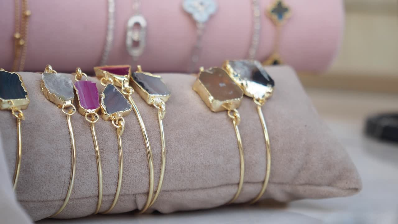 Assortment of gemstone bracelets on display