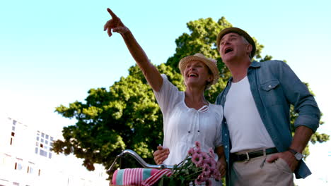 Senior-couple-going-on-a-bike-ride-in-the-city