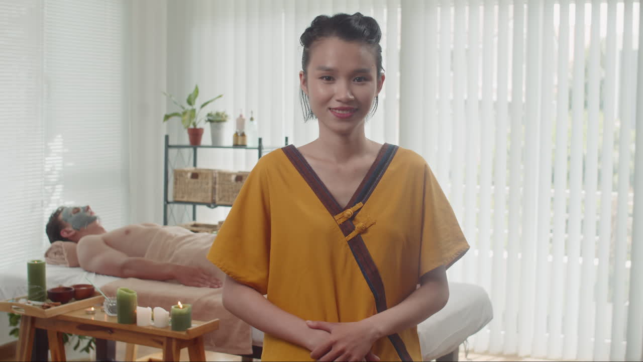 Portrait of Young Asian Cosmetologist Working at Beauty Studio