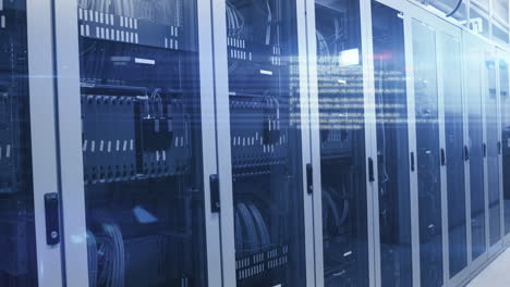 computer servers in a server room with glowing lights