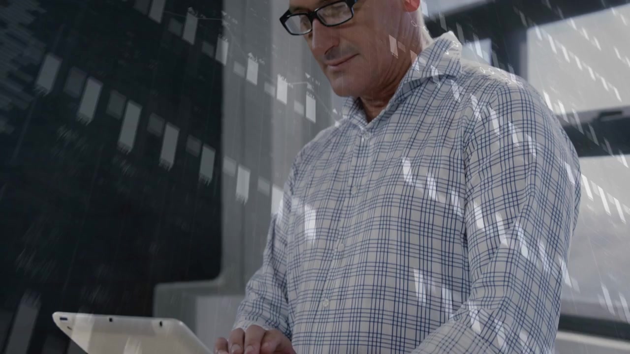Male analyst raising tablet to scan, tapping to review analytics while charts overlay tablet