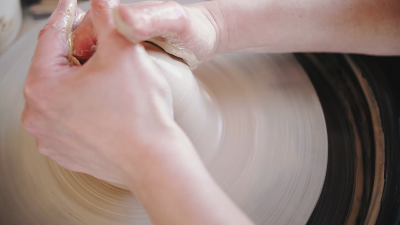 Potter's wheel potter works with his hands