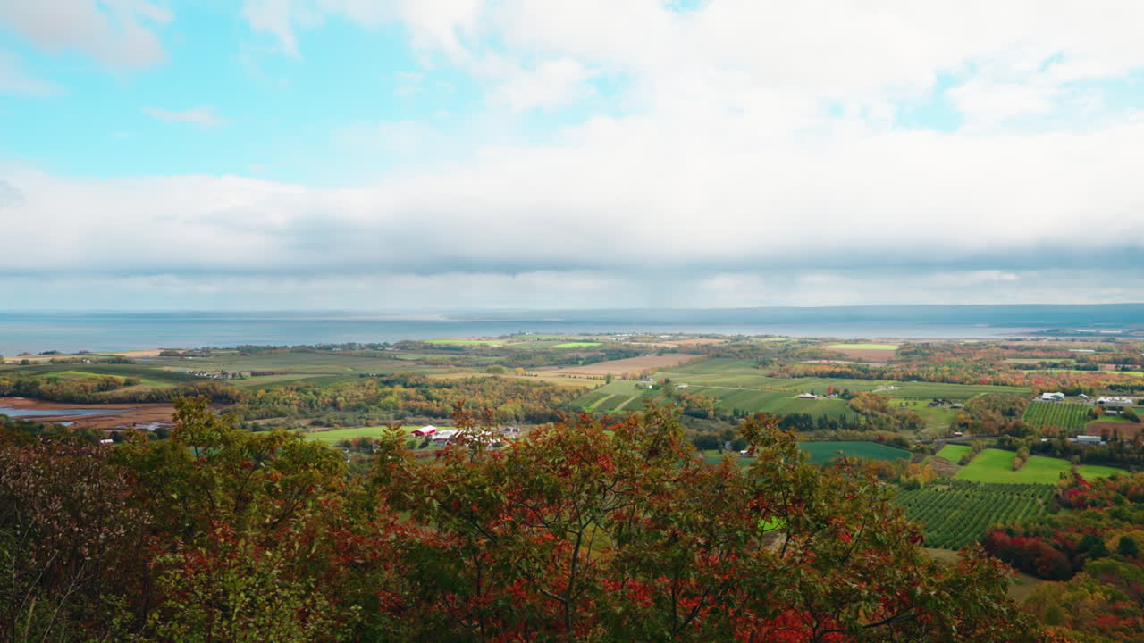 Picturesque landscape view of Nova Scotia, Canada from high view point. Vibrant Autumn colors. View of the rural, peaceful scenery.