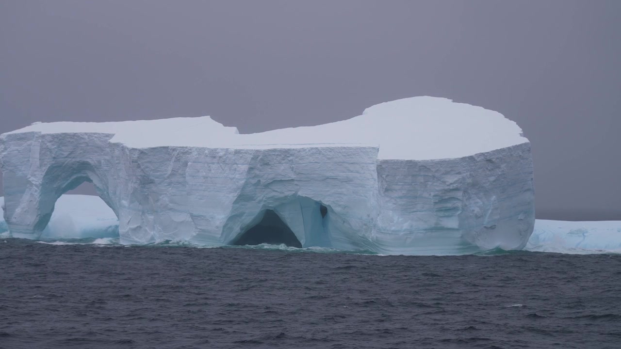 Massive Iceberg Floating in Cold Arctic Ocean Water, Panorama