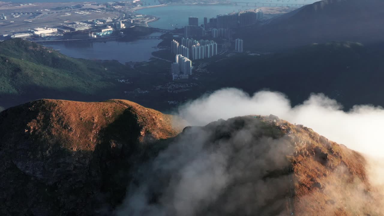 A time-lapse video of Slow moving clouds moving along the ridge of the Lantau peak (960m) in Lantau island the largest island in Hong Kong.Landscape of Lantau Island, Hong Kong, China