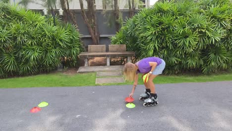 roller skater practicing skills with cones