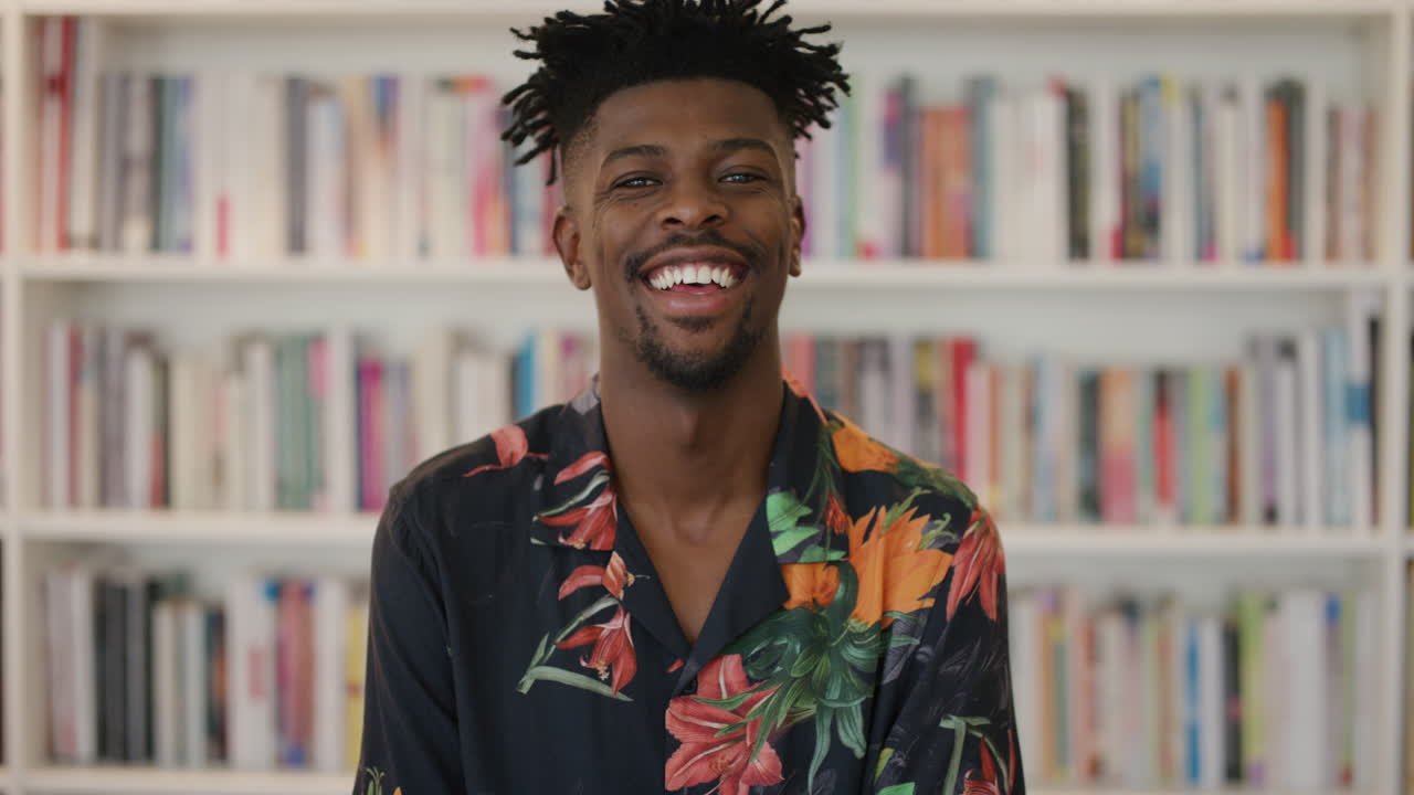 portrait attractive african american man laughing enjoying successful black male funky hairstyle looking happy expression