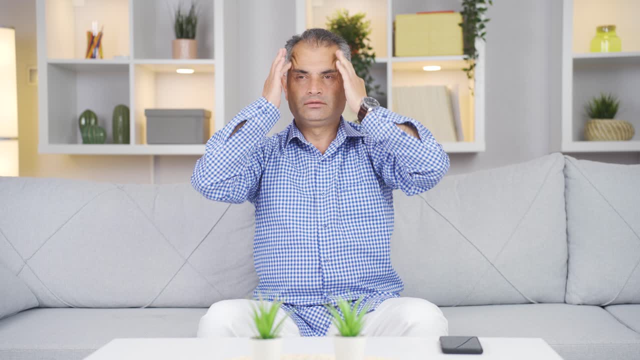 두통이 있는 남자.