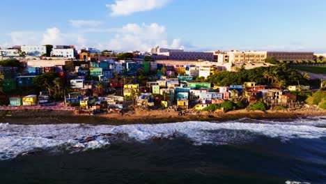 Aerial-shot-of-colorful-houses,-on-beach,-in-Puerto-Rico