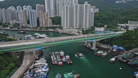 Aerial-drone-view-of-Chinese-modern-river-bridge-in-Aberdeen,-Hong-Kong