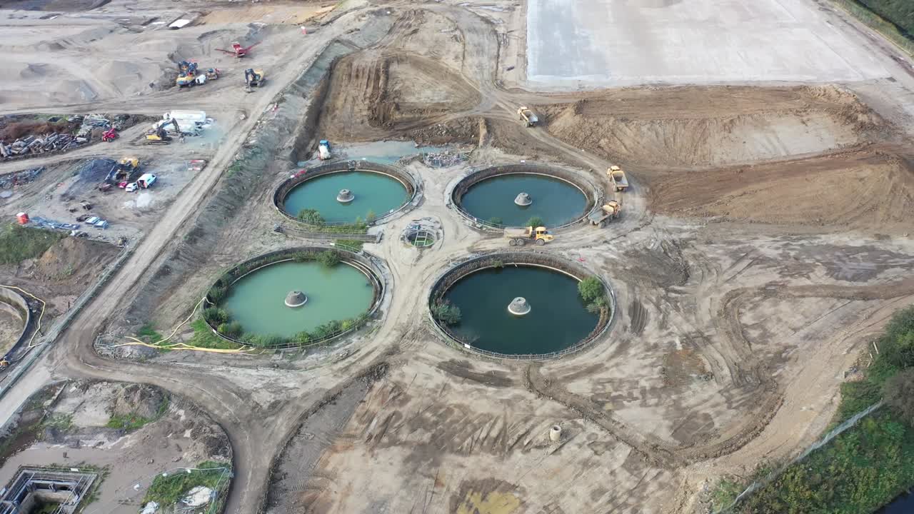 Aerial footage of purification tanks of modern wastewater treatment plant, the waste water and sewage treatment plant is located in the town of Leeds in West Yorkshire UK