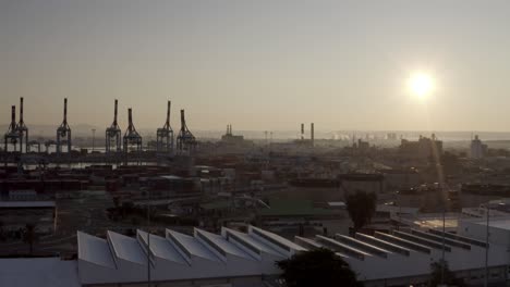 sunrise over industrial port