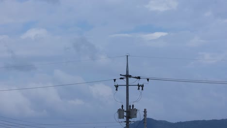 telephone pole of timelapse moving clouds