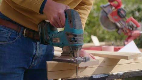 close up of cutting wood with a jigsaw