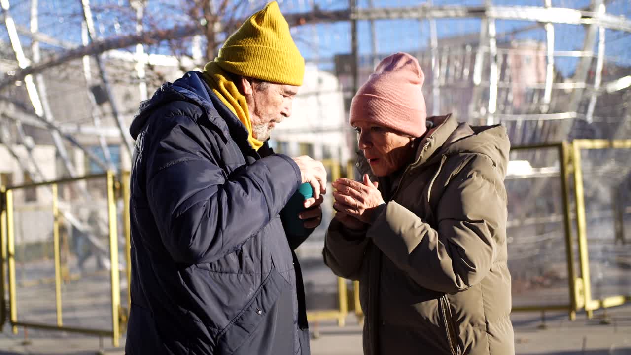 People in Winter Coats Outdoors