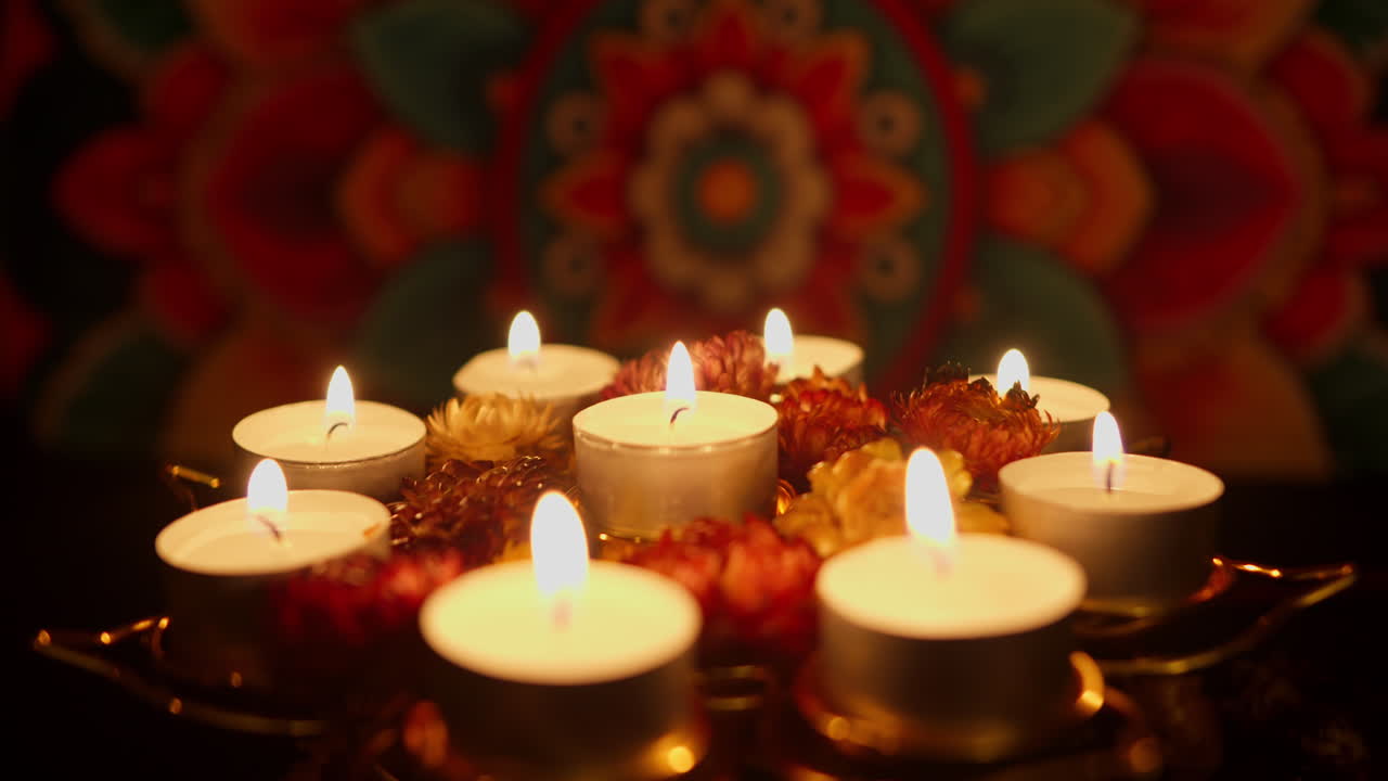 Hand Lighting Tea Light Candles for a Spiritual Celebration