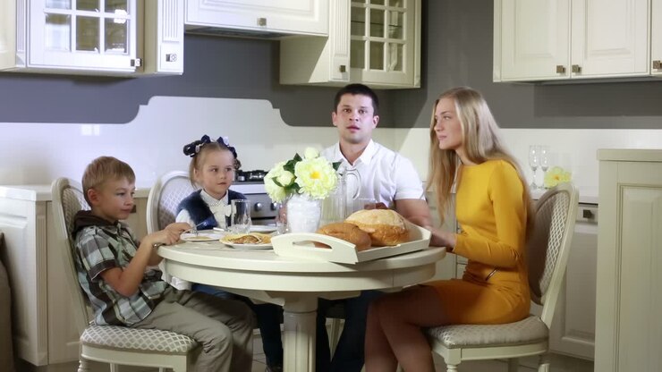 Family having breakfast at the table
