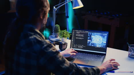 Teleworking IT specialist in apartment office uses programming to upgrade AI