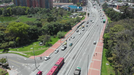 Traffic-In-Bogota---Vehicles-And-TransMilenio-Articulated-Bus-Driving-In-City-Road-In-Colombia