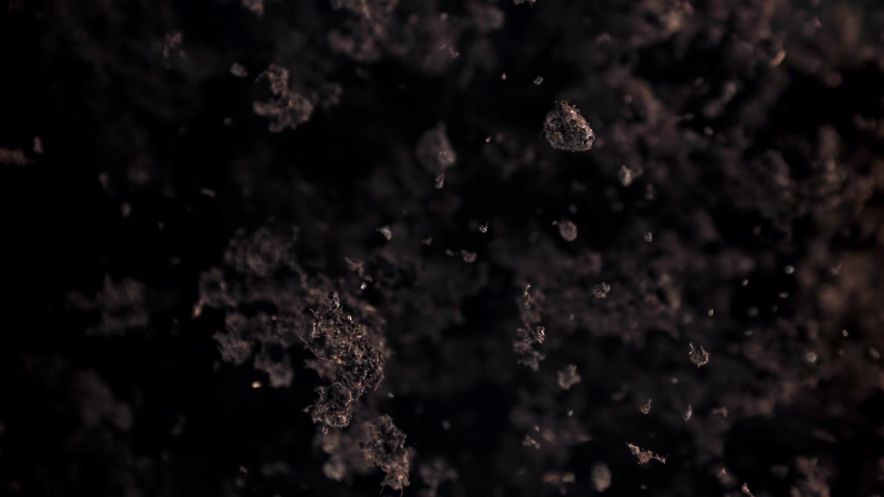 Abstract Slow Motion of Floating Dust Particles on Dark Background