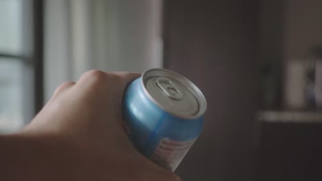 Hands-Opening-A-Can-Of-Soda.-closeup