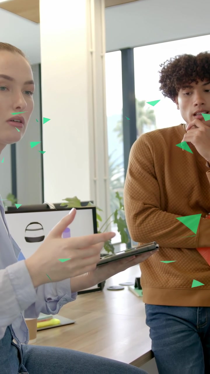 Vertical video: Woman tapping tablet and explaining, starting UX review with green triangle overlay