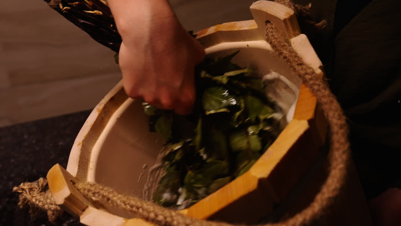 Preparing a birch broom for a traditional Russian bath