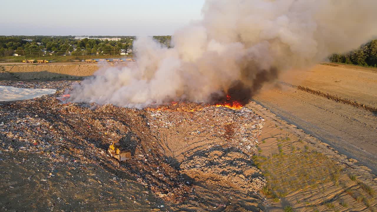 Wide drone video of burning landfill in Woodland Meadows, Romulus, MI, USA