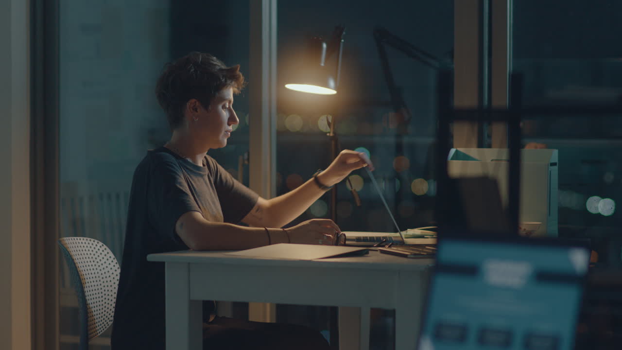 Woman Finishing Work and Leaving Office at Night