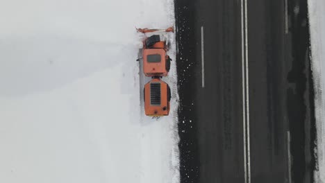 vehicles running snowy road