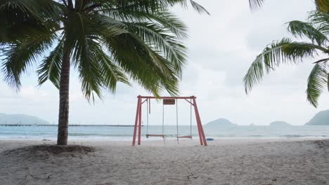 Empty-Swings-At-The-Tropical-Beach-Of-Bai-Tam-An-Hai-In-Ba-Ria---Vung-Tau,-Vietnam