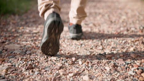 hiking, legs or person walking on path for fitness