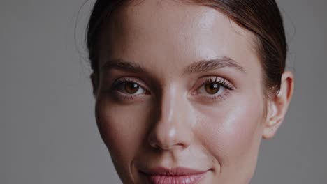 close-up portrait of a woman with natural makeup, shot at eye level