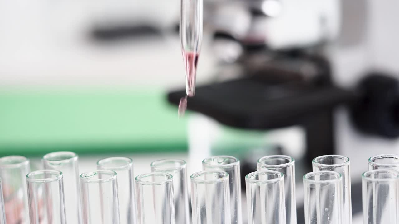 Scientific experiment with test tubes and pipette in a laboratory