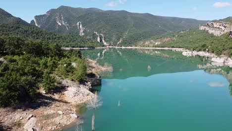 congost de mont rebei canyon at ager, catalonia and aragon, spain - aerial drone view of the blue emerald noguera ribagorzana river, green mountains and water mirror