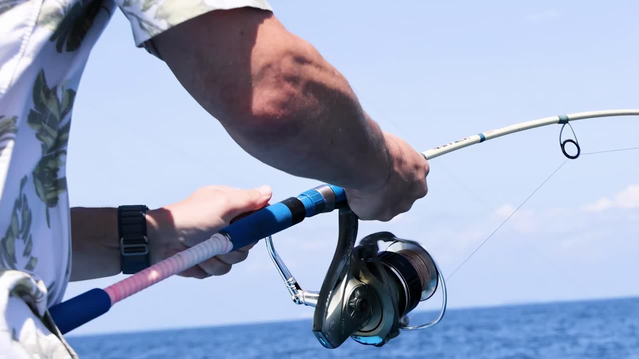 Man Fishing from a Boat