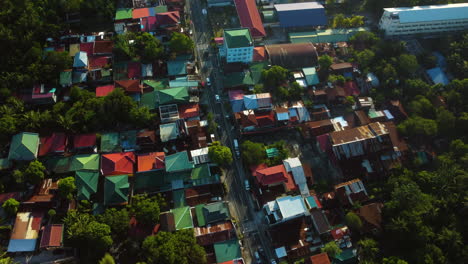 Drone-overview-of-colorful-dwellings-in-the-Province-of-Laguna,-in-Philippines,-sunny-evening